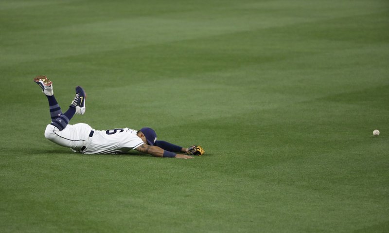 San Diego Padres second baseman Yangervis Solarte can't reach a single by Colorado Rockies' DJ LeMahieu during the fifth inning of a baseball game Wednesday, May 3, 2017, in San Diego. (AP Photo/Gregory Bull)