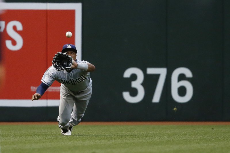 San Diego Padres' Allen Cordoba dives to make the catch on a line drive hit by Arizona Diamondbacks' A.J. Pollock during the first inning of a baseball game Thursday, April 27, 2017, in Phoenix. (AP Photo/Ross D. Franklin)