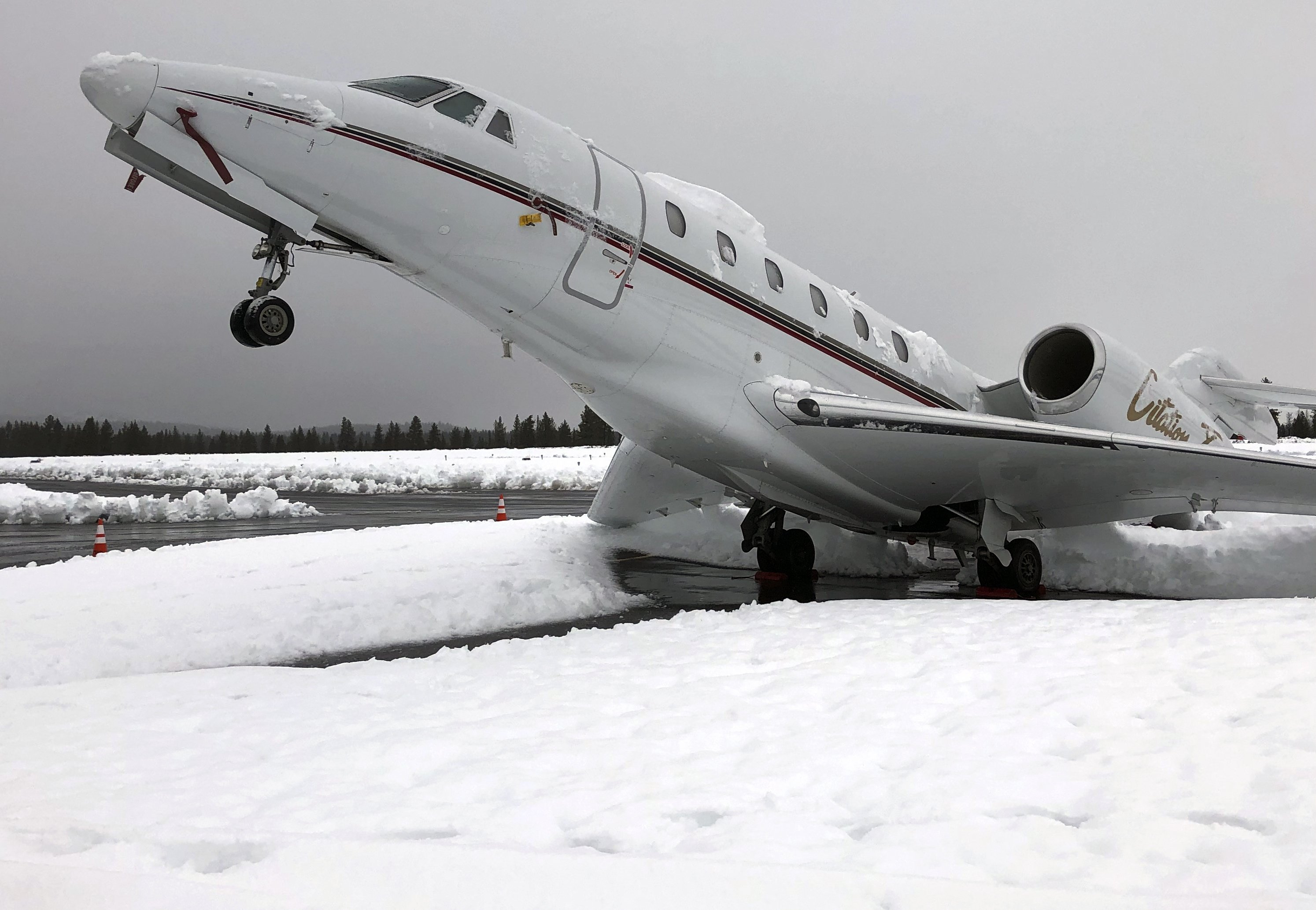 Heavy Snow Causes Jet To Pull Stationary Wheelie At Airport