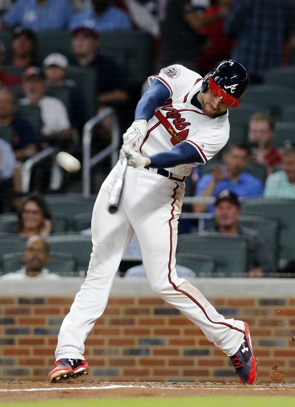 Atlanta Braves' Freddie Freeman connects on a two-run home run in the third inning of a baseball game against the San Diego Padres, Monday, April 17, 2017, in Atlanta. (AP Photo/John Bazemore)