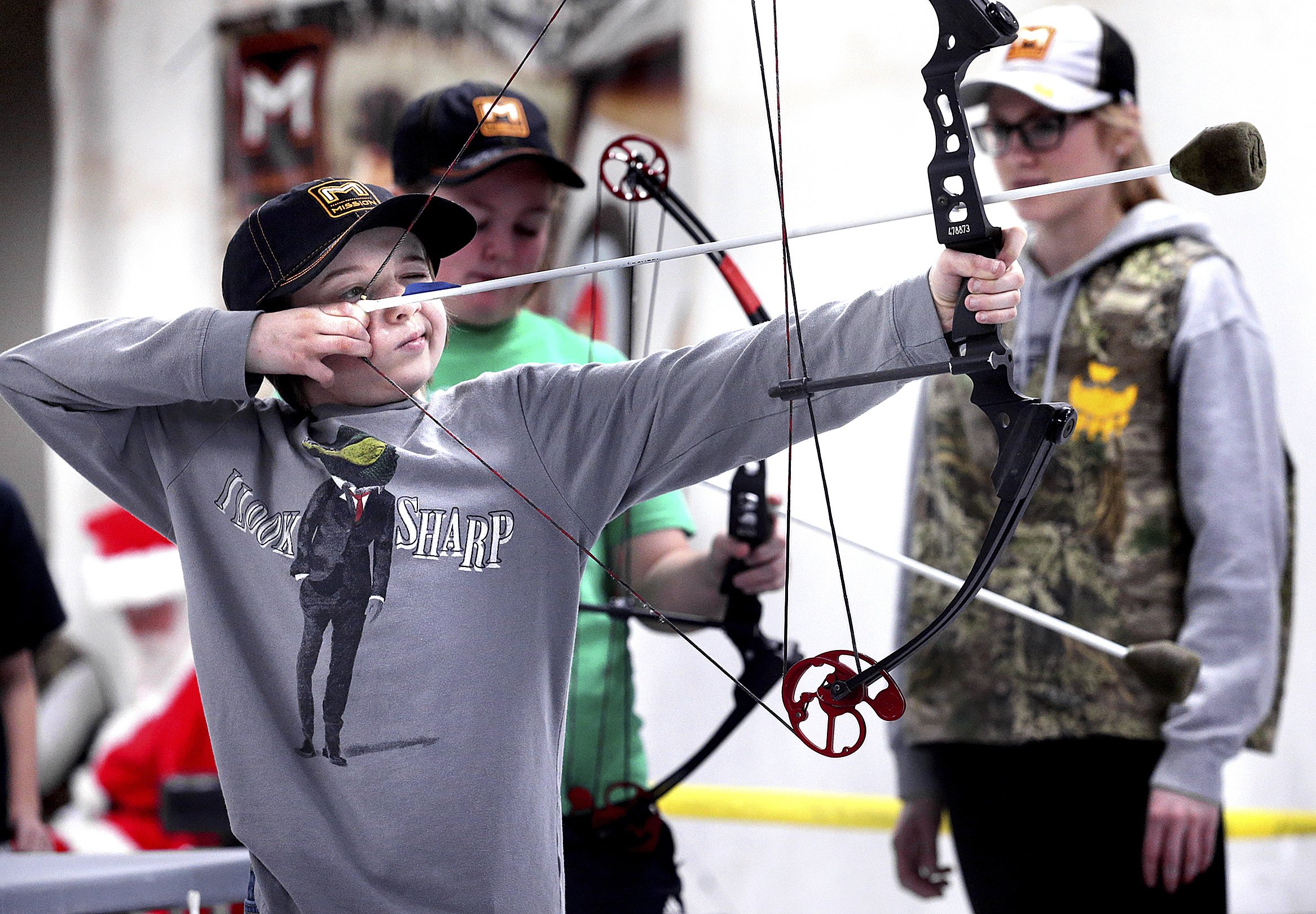 Wisconsin event offers mentorship through archery AP News