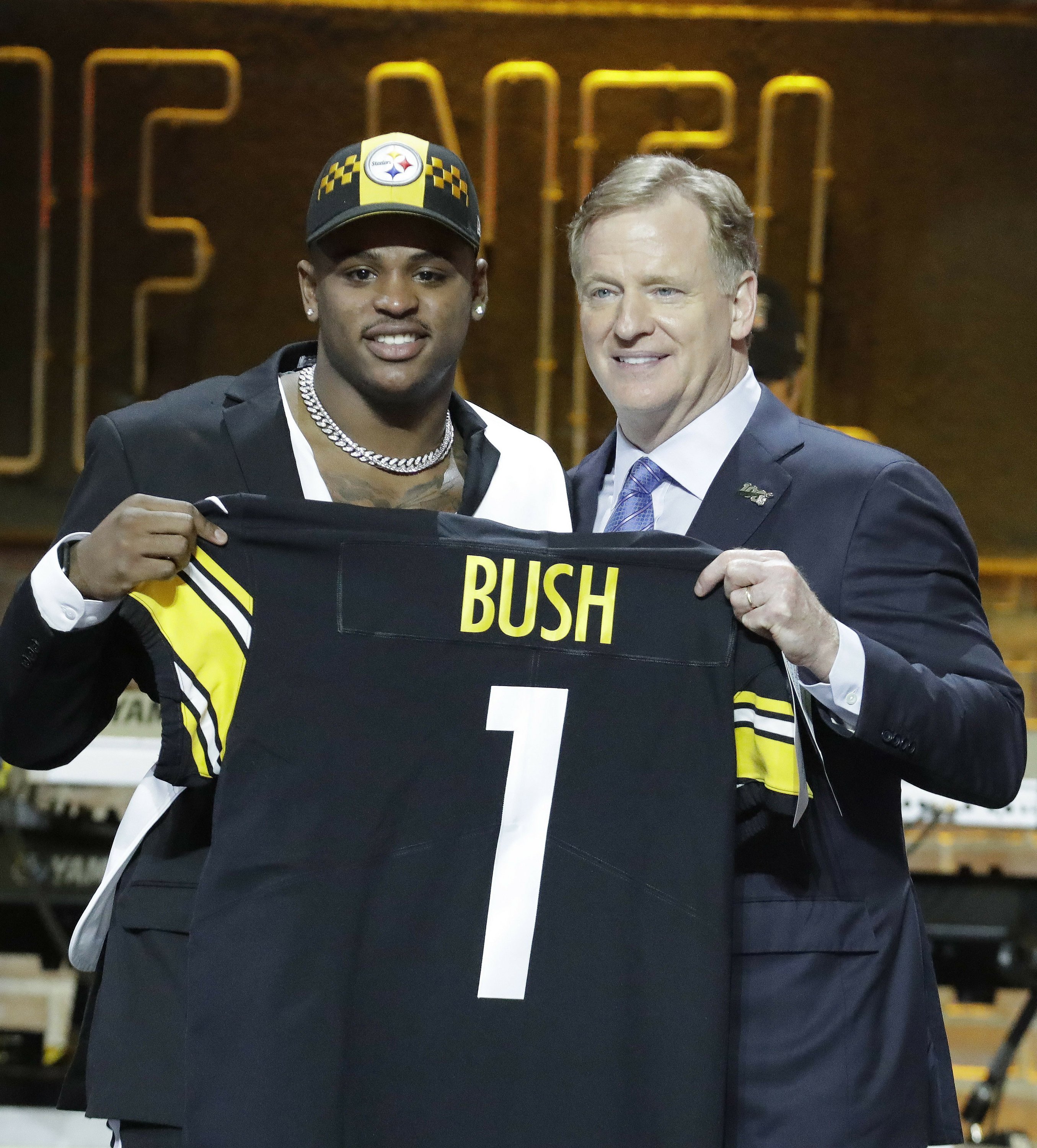 Steelers trade up in first round to draft linebacker Bush | AP News