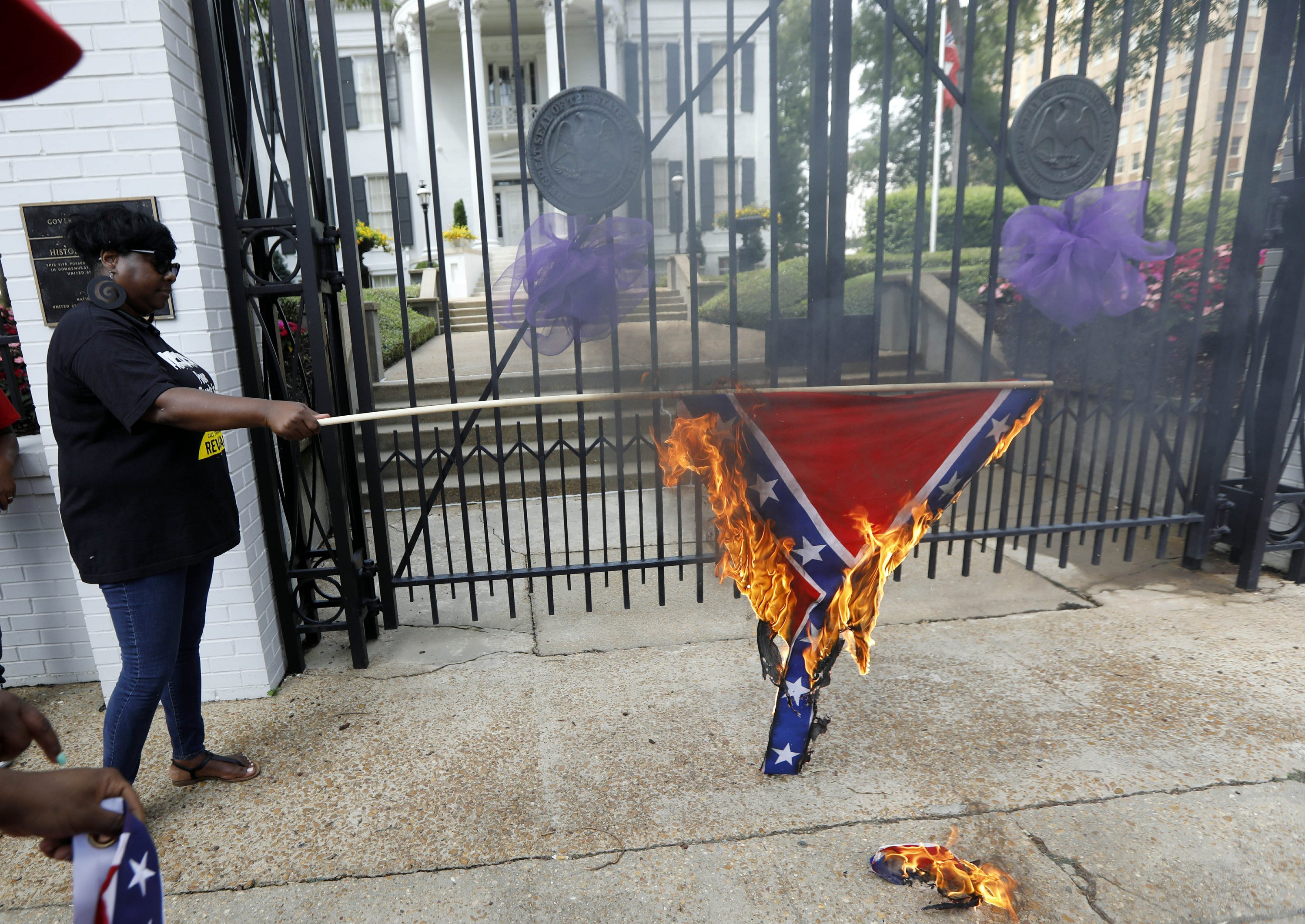 Protesters burn Mississippi flag, say it symbolizes racism AP News
