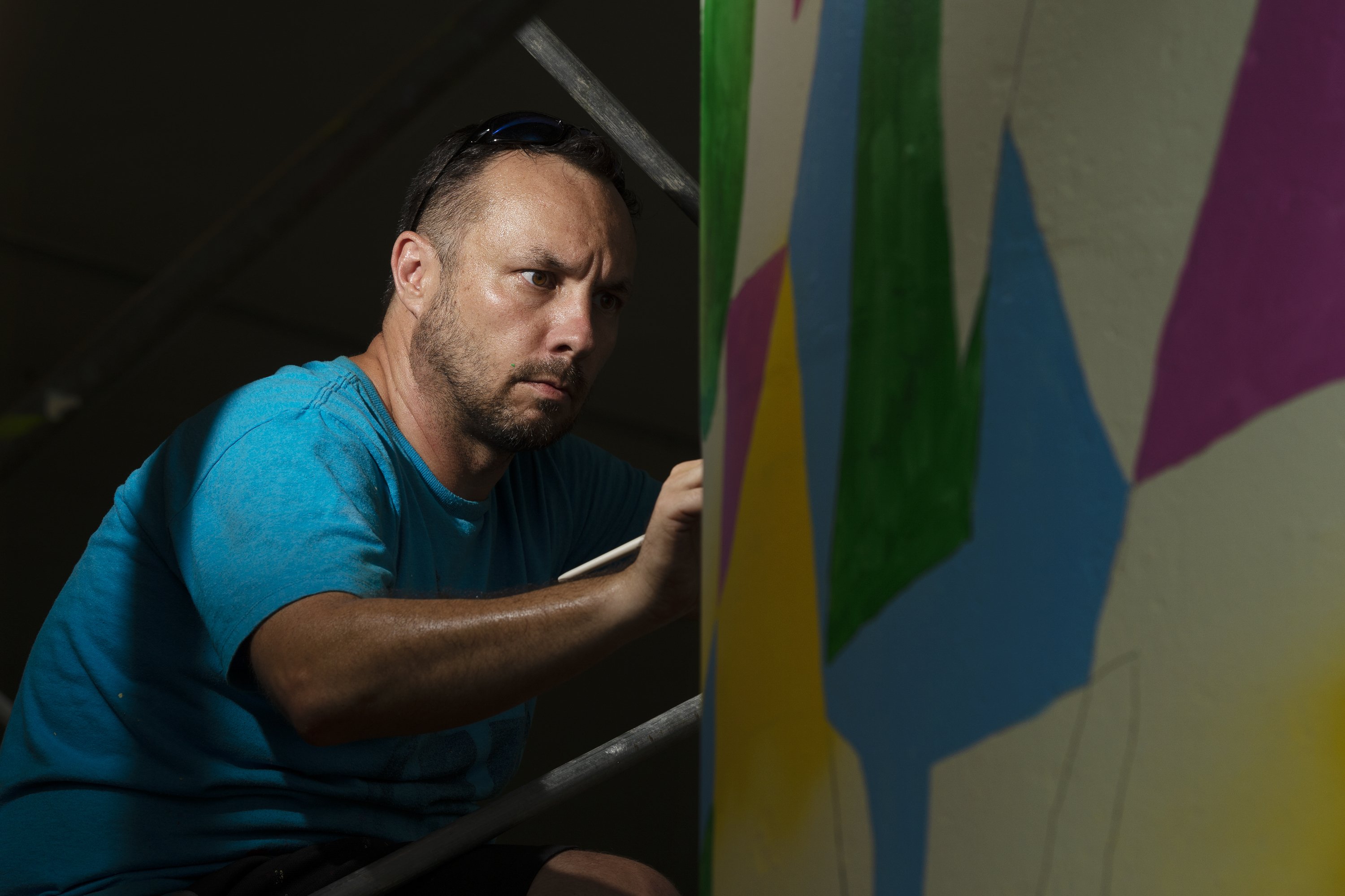 Florida artist with world record paints mural in Charleston AP News