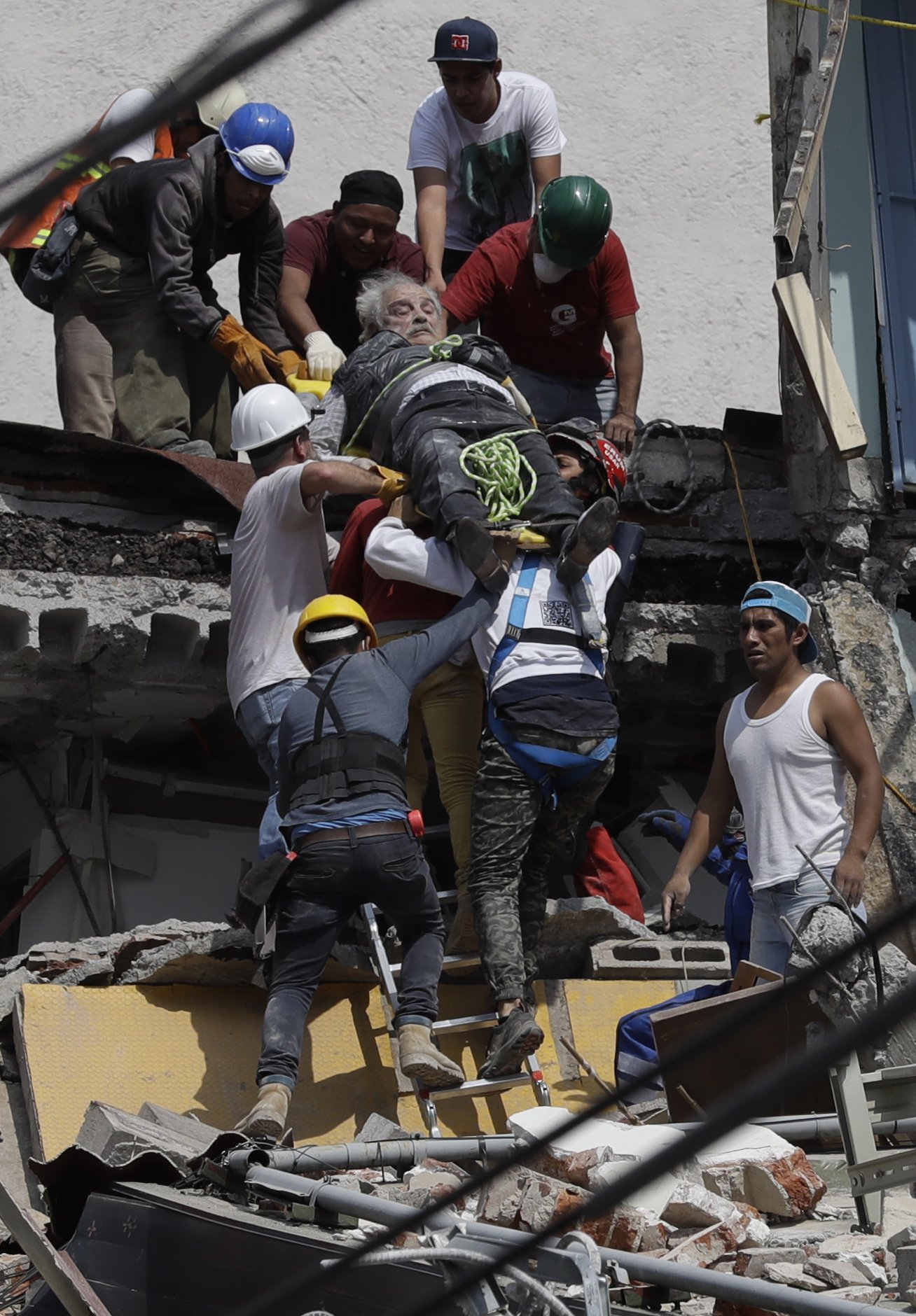 The Latest: Mexico City rescuers pull woman from rubble