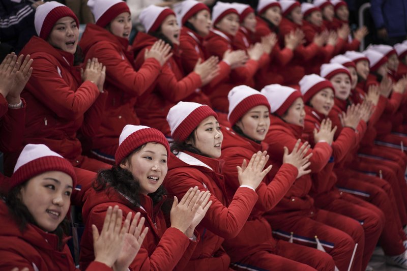 North Korean supporters cheer during the preliminary round of the women's hockey game between Switzerland and the combined Koreas at the 2018 Winter Olympics in Gangneung, South Korea, Saturday, Feb. 10, 2018. (AP Photo/Felipe Dana)