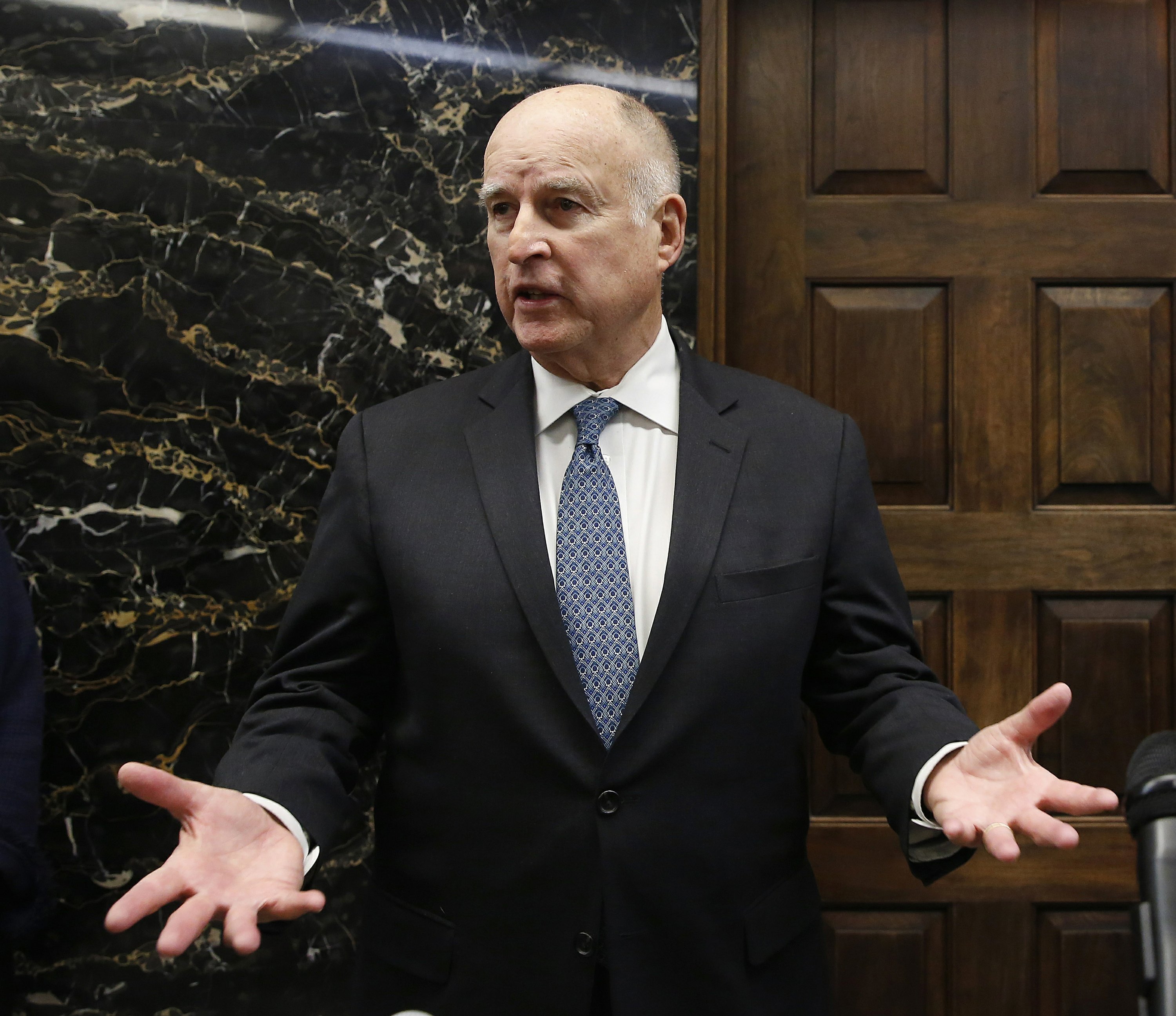 California governor pardons former state lawmaker, refugees AP News