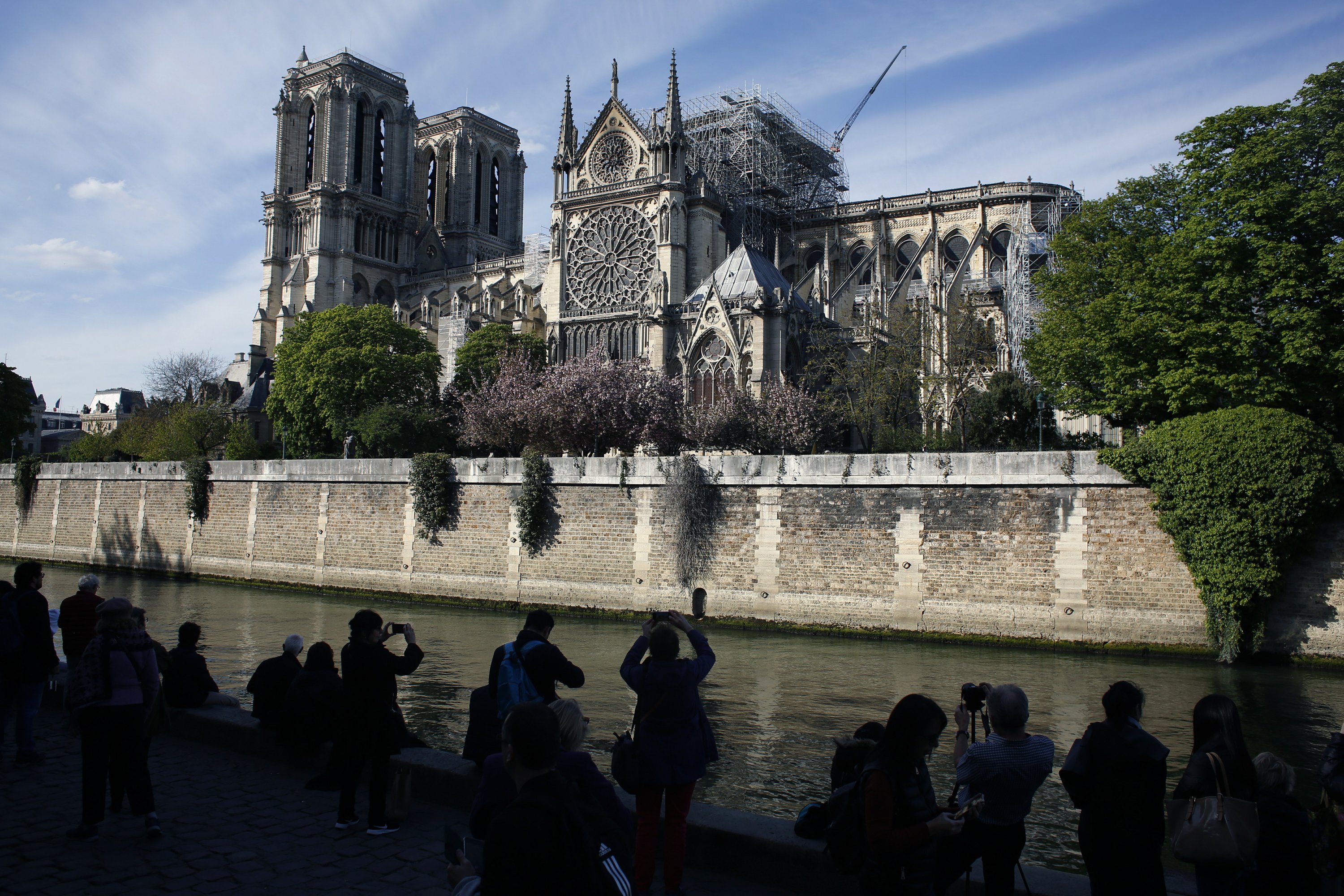 The Latest: Fire chaplain hailed as hero in Notre Dame blaze