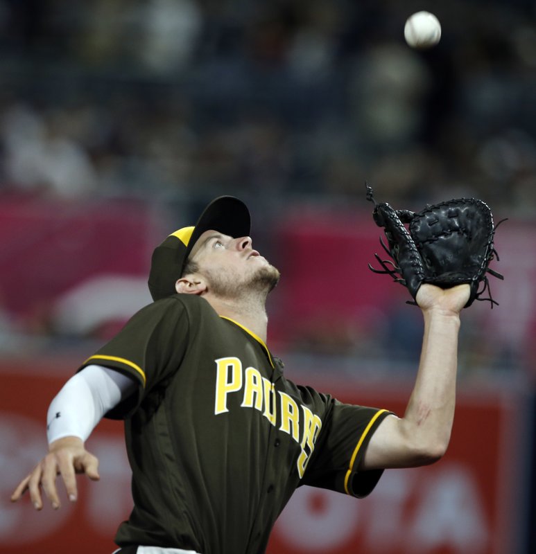 San Diego Padres first baseman Wil Myers catches a fly ball in foul territory hit by Los Angeles Dodgers’ Kenta Maeda during the fourth inning of a baseball game in San Diego, Friday, May 5, 2017. (AP Photo/Alex Gallardo)