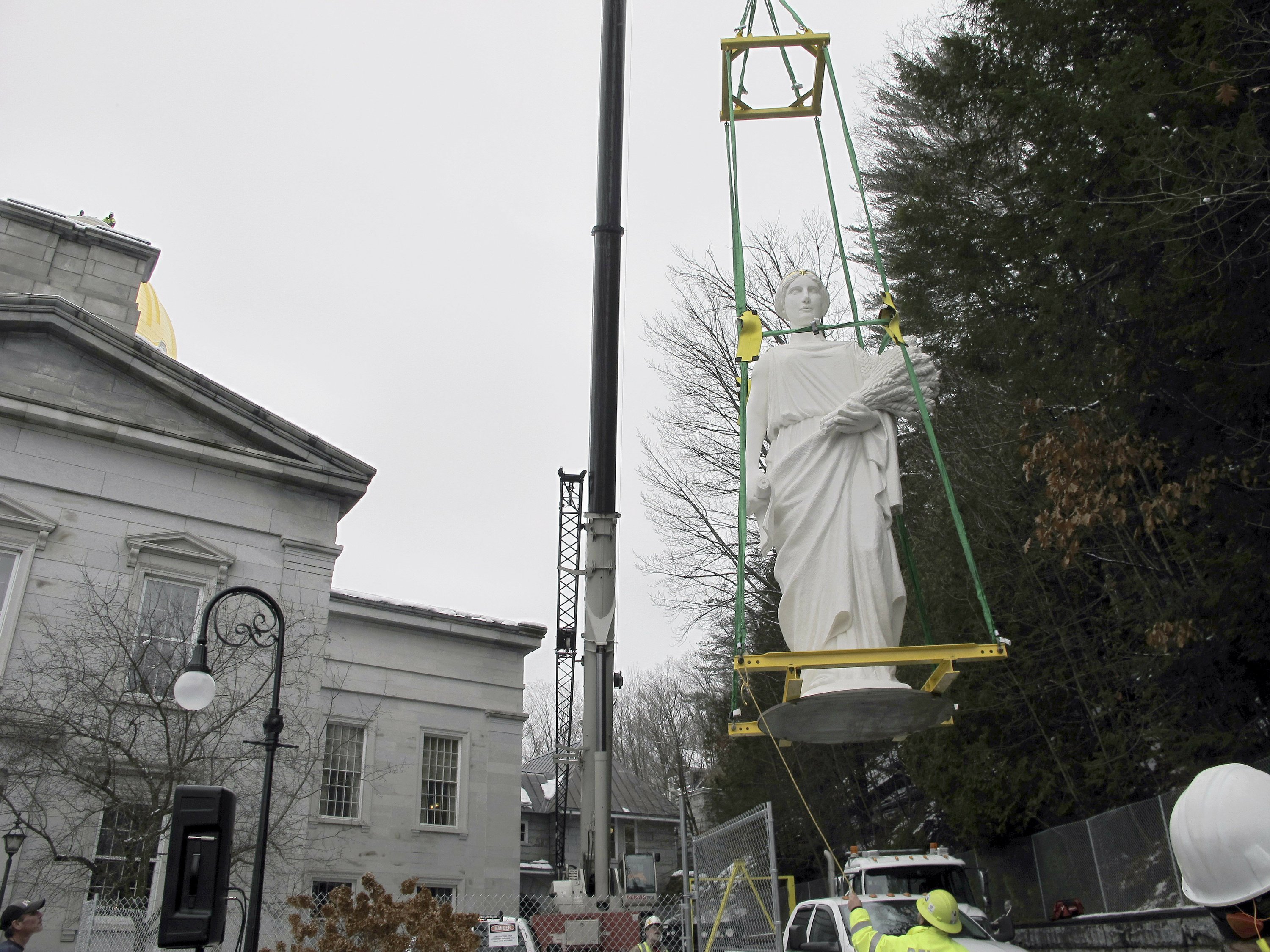 New sculpture installed on top of Vermont Statehouse AP News