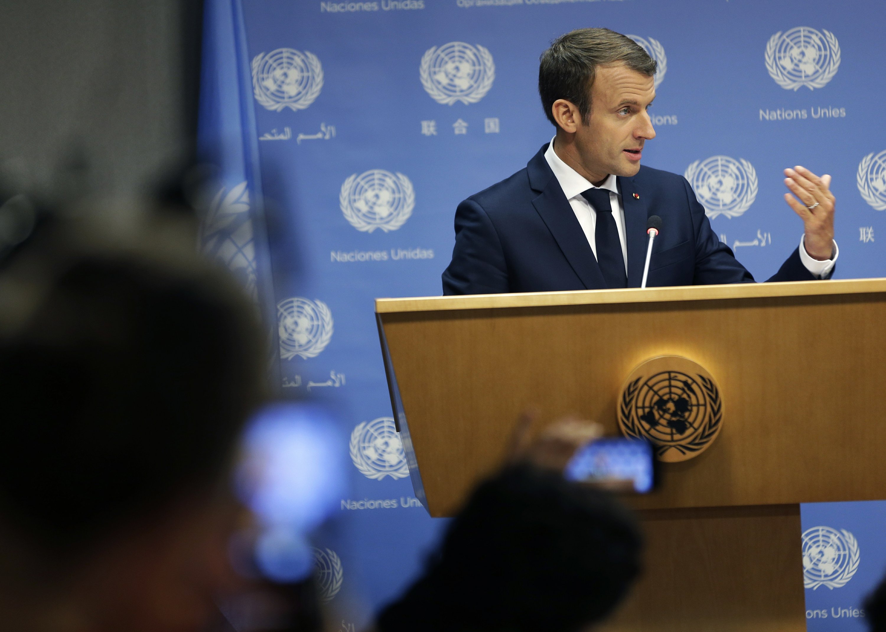 The Latest: French president calls US climate move a mistake
