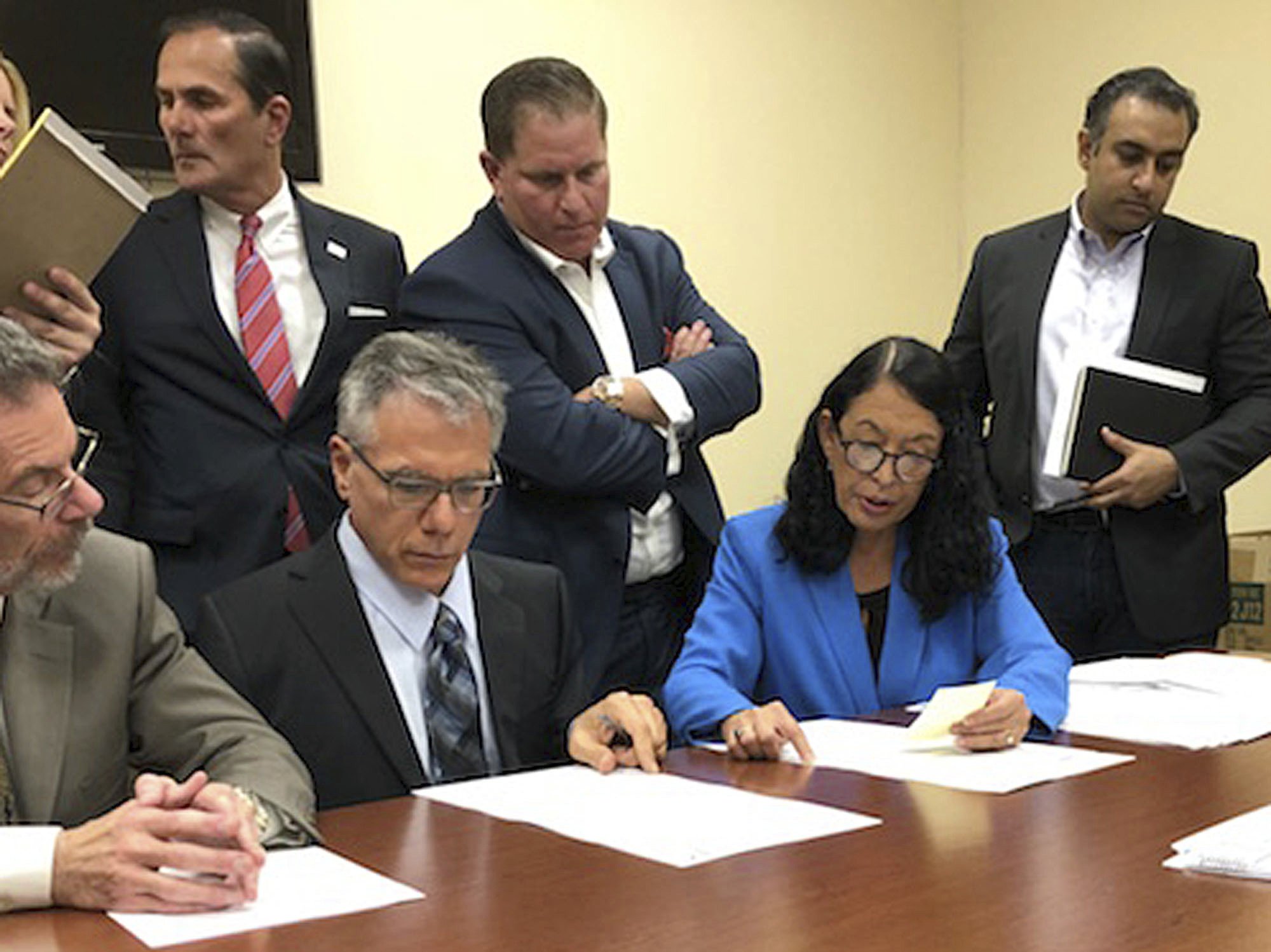 The Latest: Florida counties begin recounting ballots