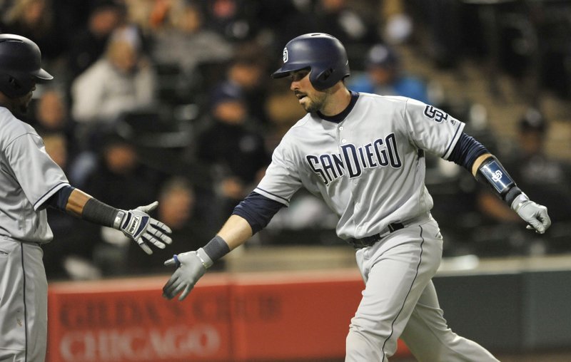 San Diego Padres' Austin Hedges right, celebrates with teammate Erick Ayabar left, at home plate after hitting a solo home run during the fifth inning of an interleague baseball game against the Chicago White Sox, Friday, May 12, 2017, in Chicago. (AP Photo/Paul Beaty)