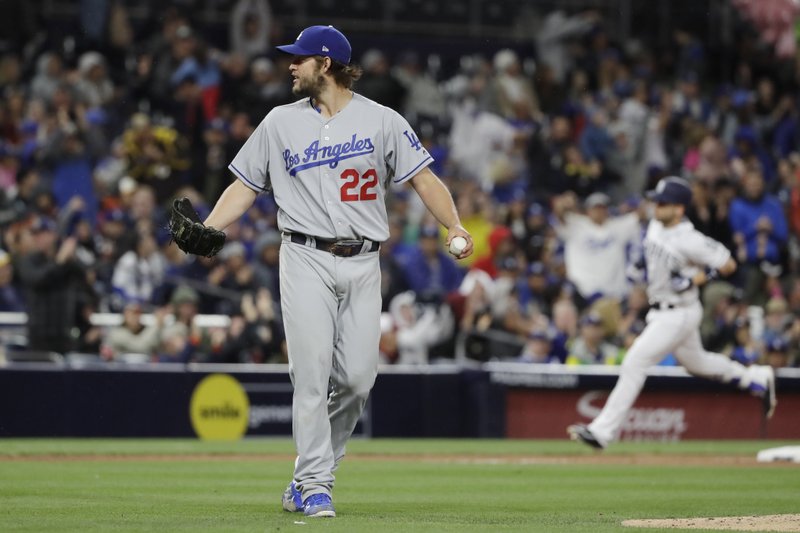 Los Angeles Dodgers starting pitcher Clayton Kershaw (22) reacts as San Diego Padres’ Ryan Schimpf rounds the bases after hitting a home run eighth inning of a baseball game Saturday, May 6, 2017, in San Diego. (AP Photo/Gregory Bull)