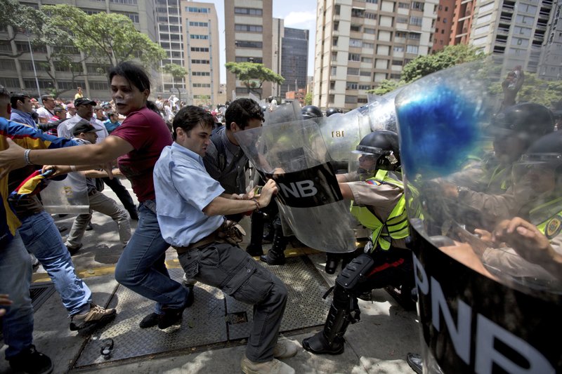 Police fire pepper spray at opposition march in Venezuela