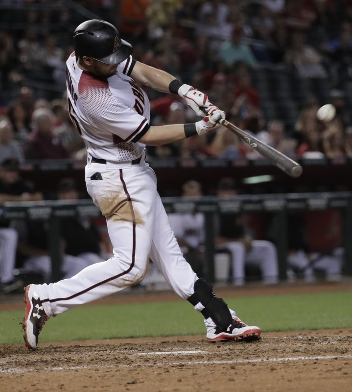 Arizona Diamondbacks' Chris Owings connects on a grand slam home run against the San Diego Padres during the fifth inning of a baseball game, Monday, April 24, 2017, in Phoenix. (AP Photo/Matt York)