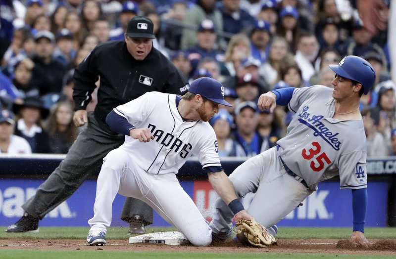 Los Angeles Dodgers' Cody Bellinger (35) safely steals third base as San Diego Padres third baseman Cory Spangenberg is late with the tag during the fourth inning of a baseball game Saturday, May 6, 2017, in San Diego. (AP Photo/Gregory Bull)
