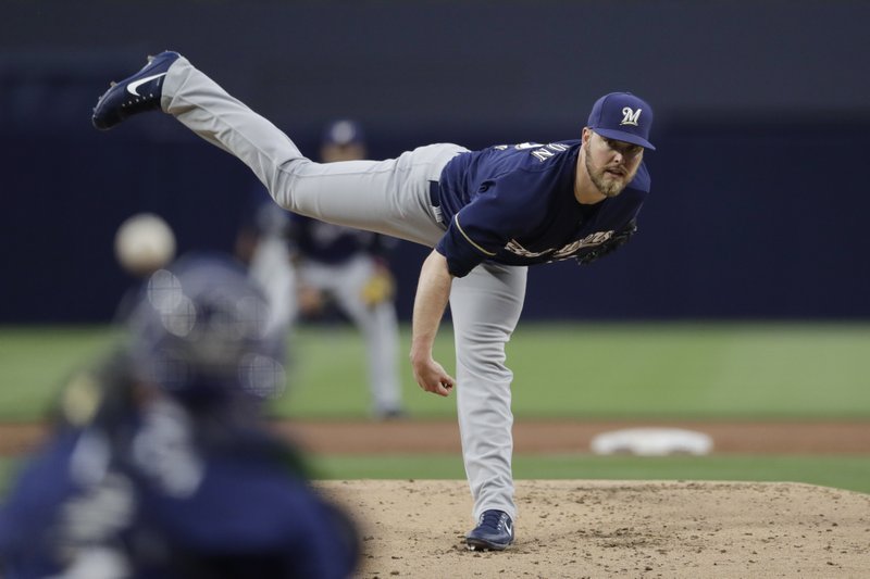 Milwaukee Brewers starting pitcher Jimmy Nelson pitches to a San Diego Padres batter during the first inning of a baseball game, Tuesday, May 16, 2017, in San Diego. (AP Photo/Gregory Bull)