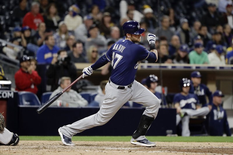 Milwaukee Brewers' Jett Bandy watches his RBI single during the ninth inning of the team’s baseball game against the San Diego Padres on Wednesday, May 17, 2017, in San Diego. (AP Photo/Gregory Bull)
