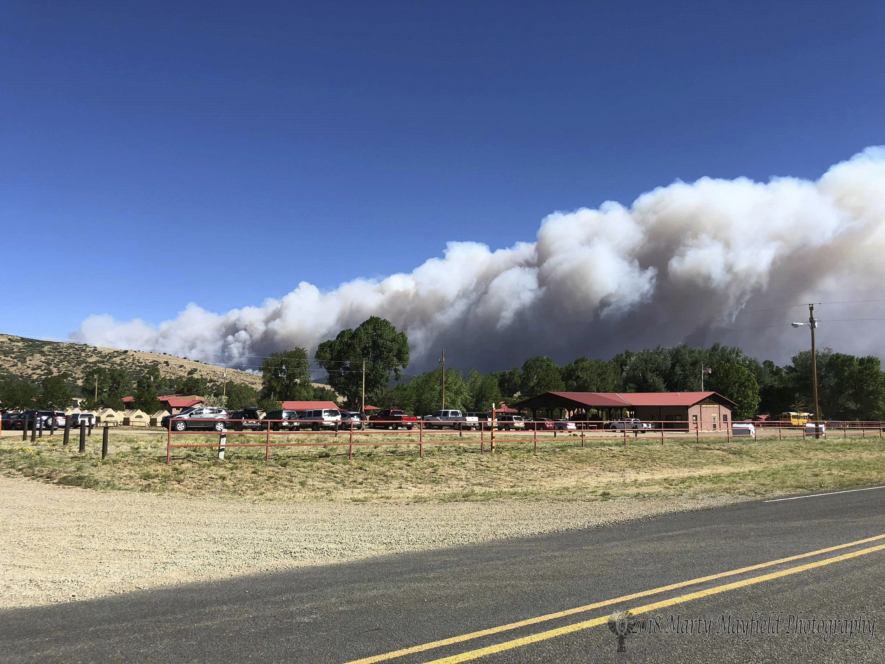 New Mexico wildfire threatening village doubles in size AP News