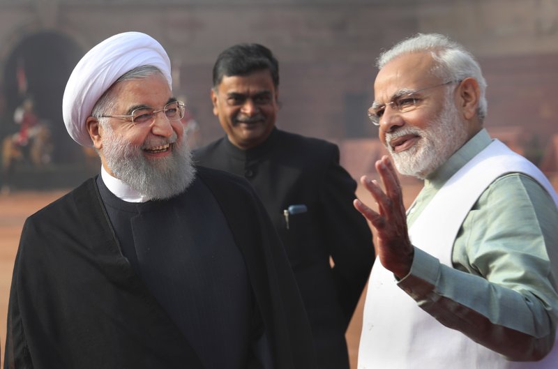 Indian Prime Minister Narendra Modi, right, talks to Iranian President Hassan Rouhani, left, during later's ceremonial reception at the Indian presidential palace in New Delhi, India, Saturday, Feb. 17, 2018. Rouhani, who is on three days state visit to India has strongly criticized the Trump administration's recognition of Jerusalem as Israel's capital and urged Muslims to support the Palestinian cause. Hassan Rouhani also lashed out at the United States for imposing a ban on travelers from six largely Muslim countries. (AP Photo/Manish Swarup)