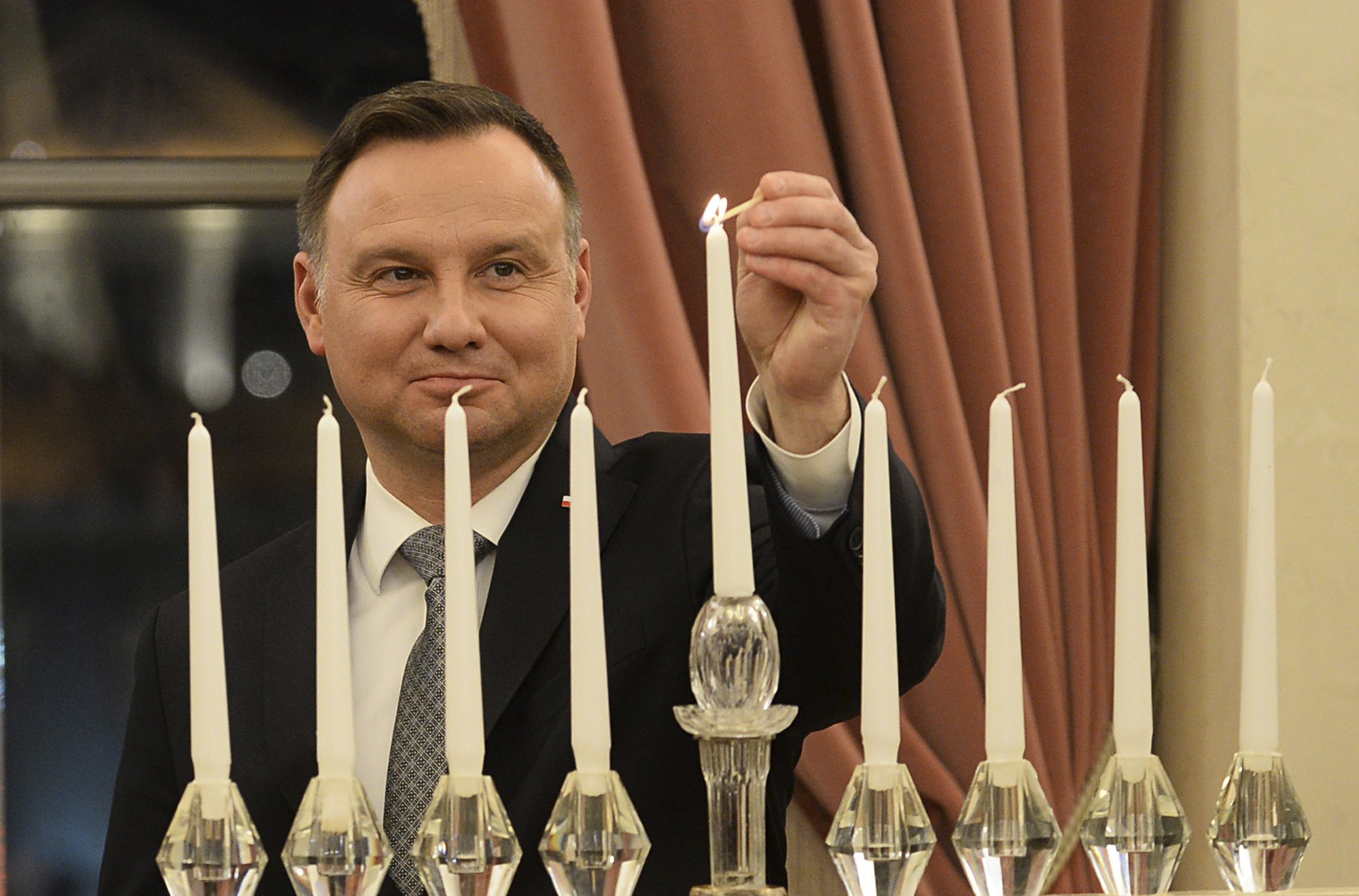 Poland's president, Jewish leaders light Hanukkah candles AP News