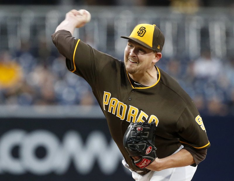 San Diego Padres starting pitcher Trevor Cahill throws to the plate against the Miami Marlins during the first inning of a baseball game in San Diego, Friday, April 21, 2017. (AP Photo/Christine Cotter)