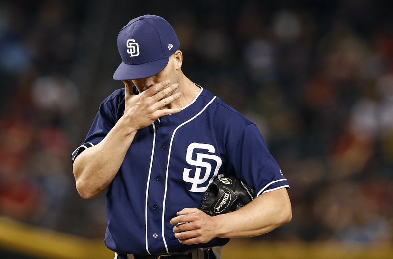 San Diego Padres' Clayton Richard pauses on the mound after giving up a two-run triple to Arizona Diamondbacks' Chris Owings during the second inning of a baseball game Tuesday, April 25, 2017, in Phoenix. (AP Photo/Ross D. Franklin)