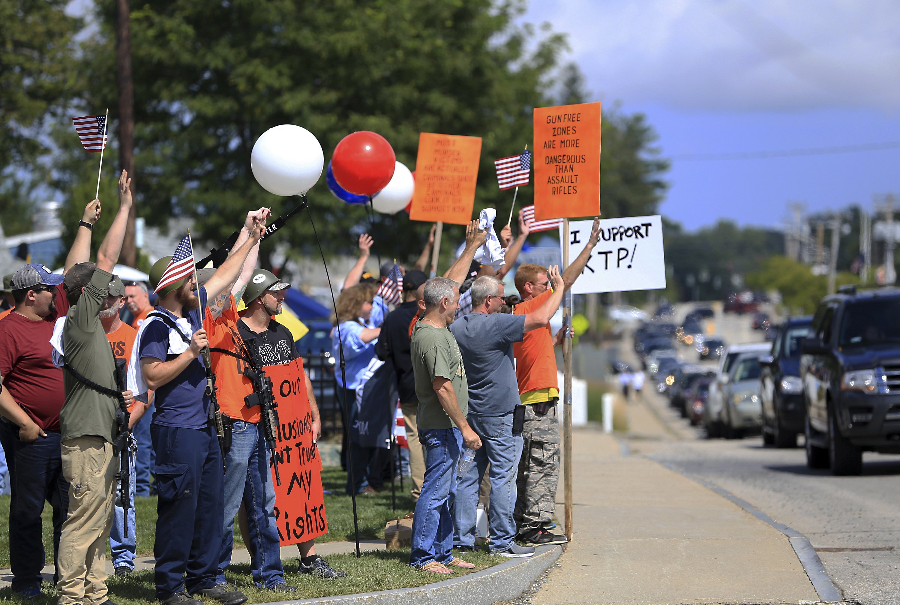 Protesters, gun advocates face off on assault-style rifles | AP News