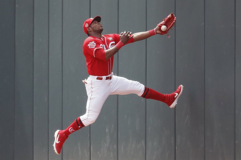 Puig returns with RBI double, Reds sweep Marlins 5-0