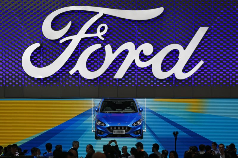 Despite Trump Tweet Ford Says It Won T Make Hatchback In Us In This April 25 2018 Photo Visitors And Journalists Gather Near A Ford Focus On Display At The Exhibit During Media Day For China Auto Show