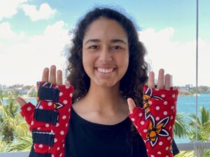 Alyssa Jamal displaying the affordable wrist splint she created.