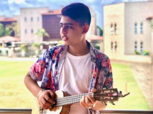 Ayaan Allarakhia with a guitar