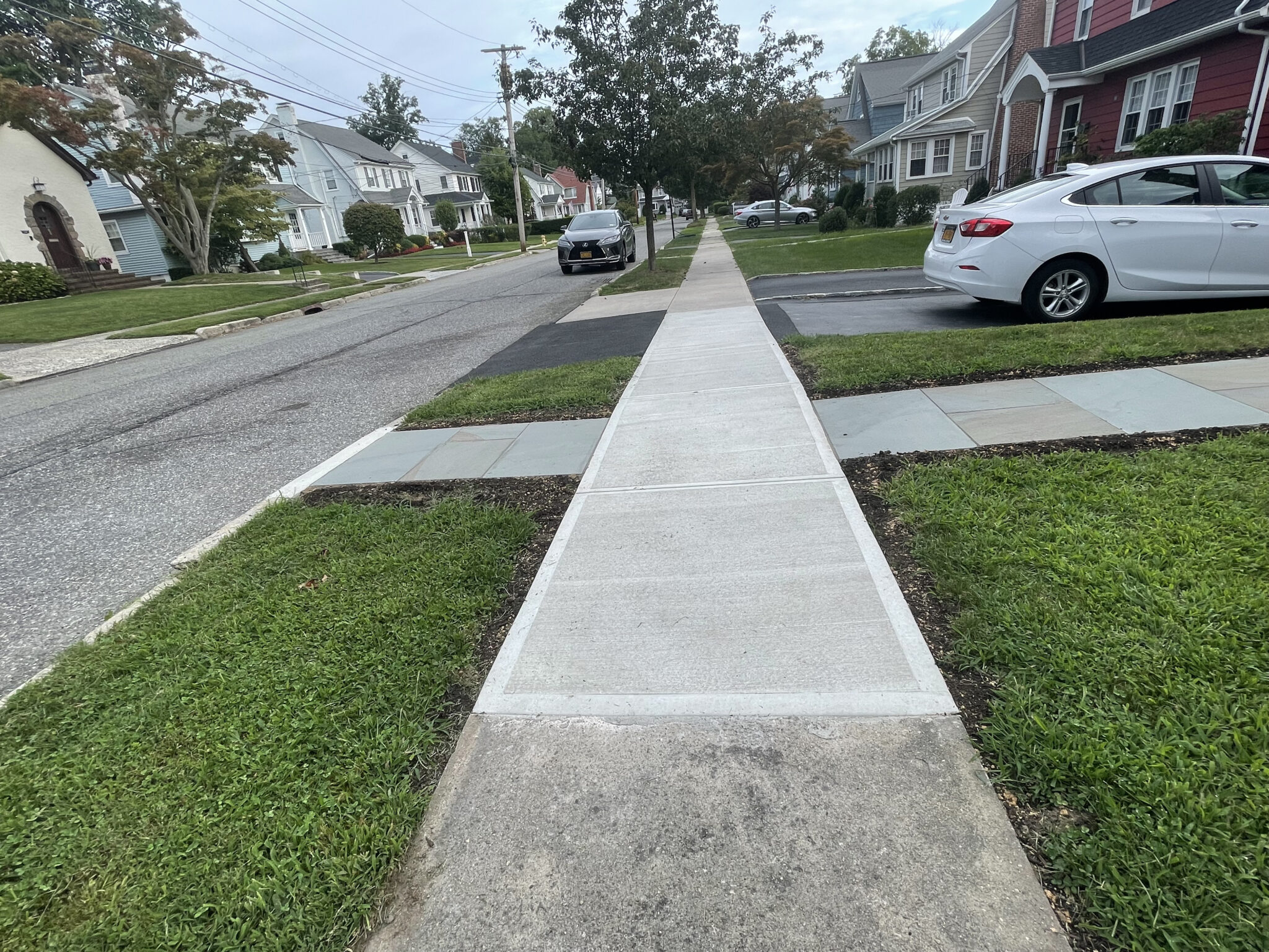 New broom-finished concrete sidewalk installation in Fairfield County CT
