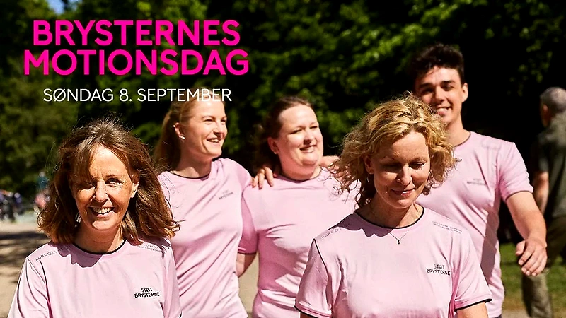 Glade mennesker i lyserøde t-shirts støtter Brysternes Motionsdag.