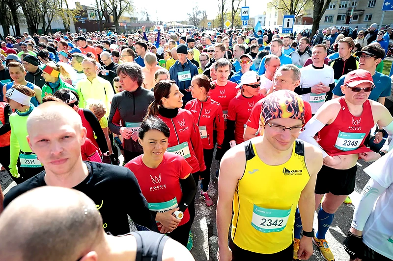 A crowd of runners with numbers at the Birštonas Half Marathon event.