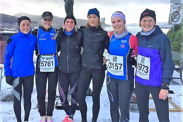 Runners in Andersen's Advent Race. Smiling women at the finish line.