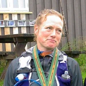 Runner with a medal after the Bèrghem Ultra Marathon.