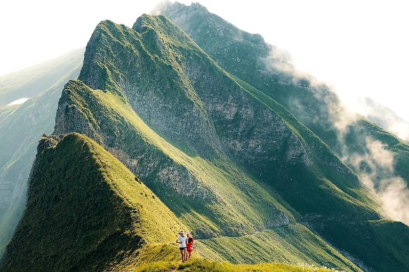 Runners on the mountain ridge.