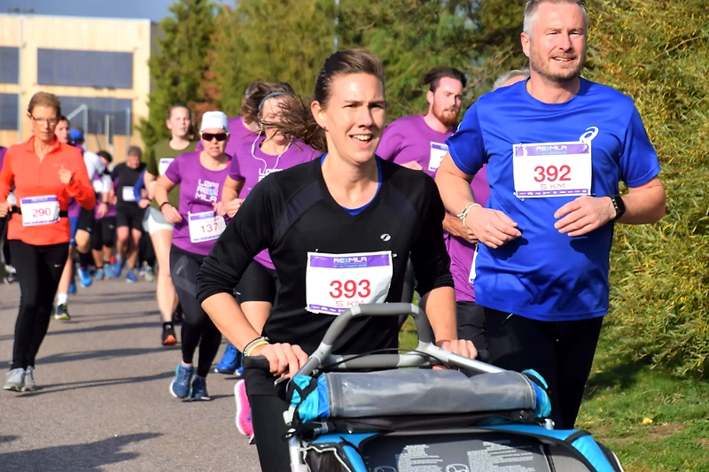 Runners participate in the Gruemila race, with race bibs.