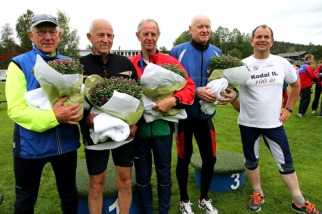Runners on the podium. One runner has