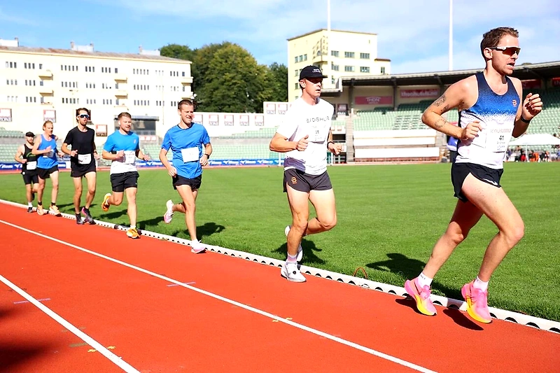 Runners on a track during a competition.