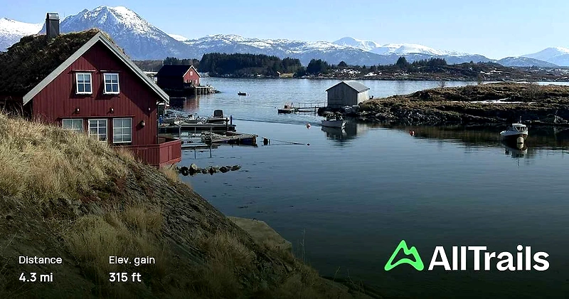 Beautiful coastal view with houses and boats, perfect for the Coastal Path Around.