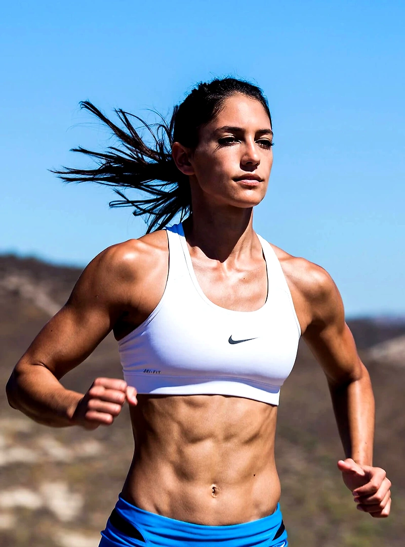 Woman running in workout clothes.