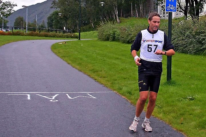 The runner is approaching the finish line in a race.