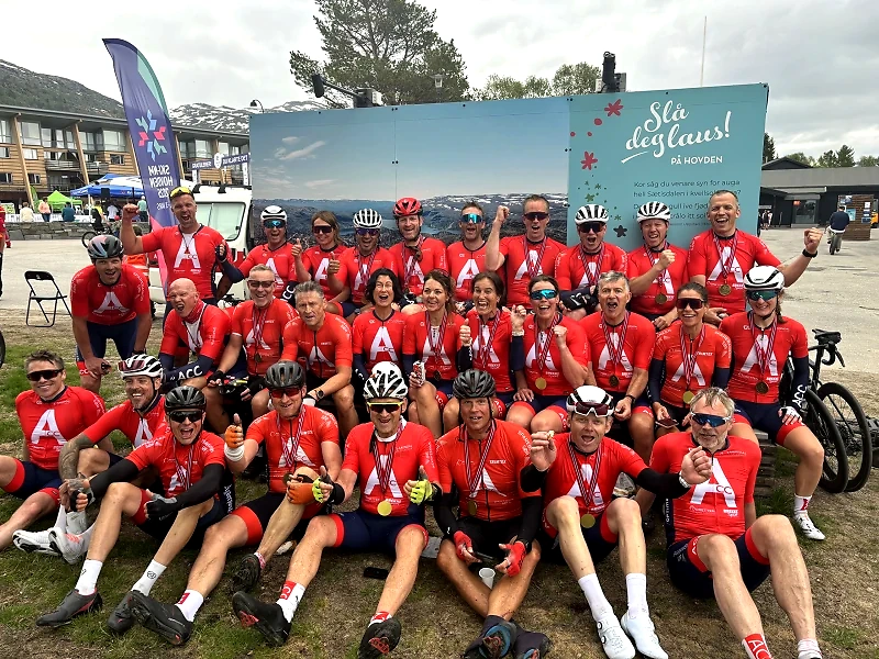 Group of cyclists with medals, probably after a race.