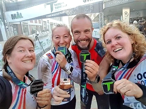 Participants of Totens Toughest with medals after the race.