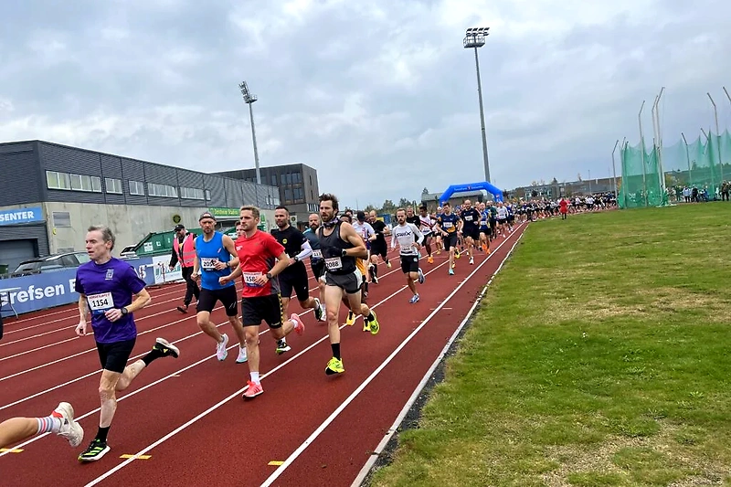 Runners starting a cross-country race.
