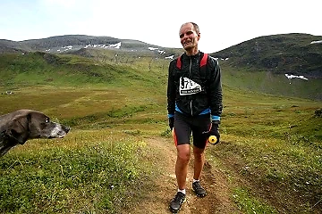 Running in mountain terrain with a dog.