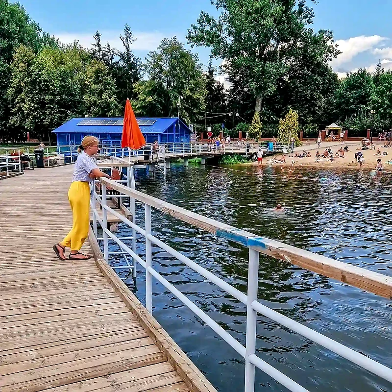 Borki Reservoir in Radom, view from the pier, people on the beach.
